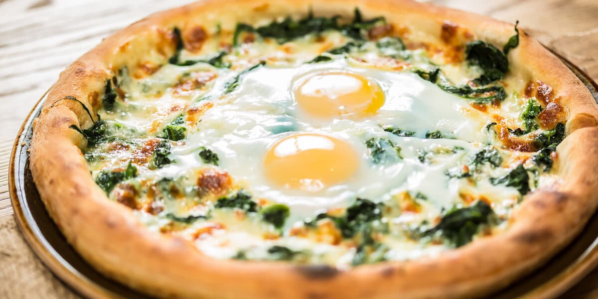 Margarita pizza with arugula and egg